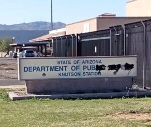 Sign vandalized to read Department of Pube